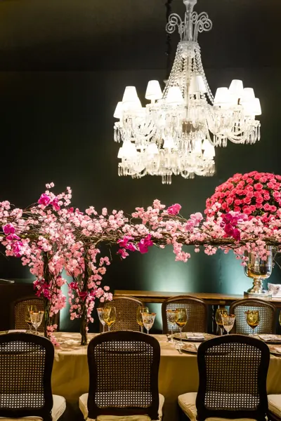 Chandelier and pink flowers at a 15th birthday party