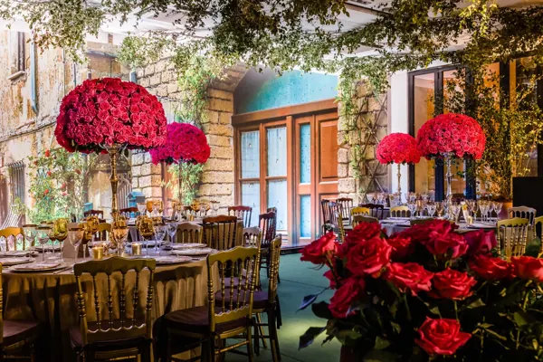 Tables and floral arrangements at a 15th birthday party