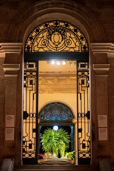 Illuminated historic entrance for a dinner at Parque Lage