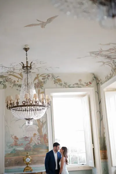 Couple in a chandelier-lit salon in Portugal