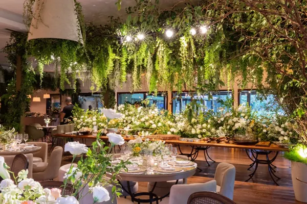 Wedding reception with flowers and hanging greenery